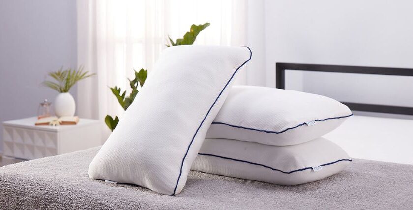 Washing a king size bed pillow to maintain cleanliness and support